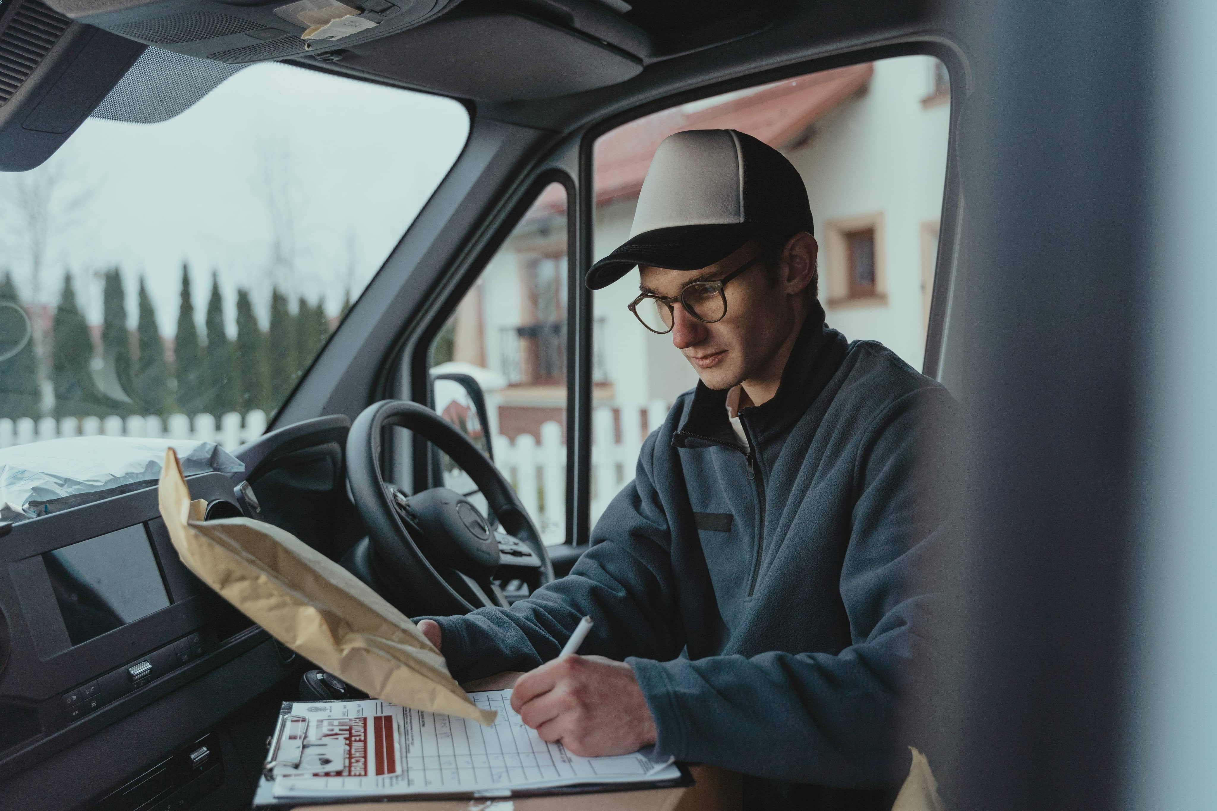a delivery man holding a clipboard